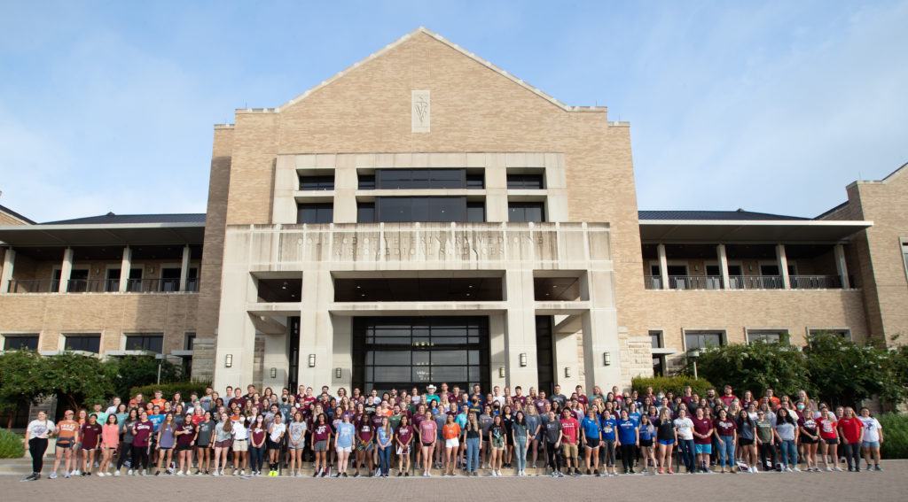 class of 2025 veterinary students standing outside the vet med building