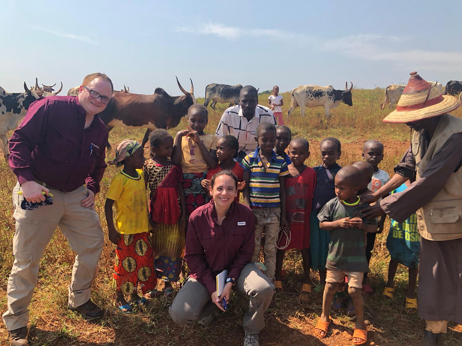 A photo of Texas A&M researchers with a group of children at a farm in Bafoussam, Cameroon.